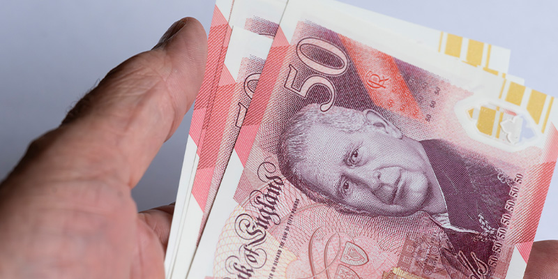 Help Redesign the UK’s Banknotes: Public Invited to Choose New Themes holding bank notes - Help Redesign the UK’s Banknotes: Public Invited to Choose New Themes